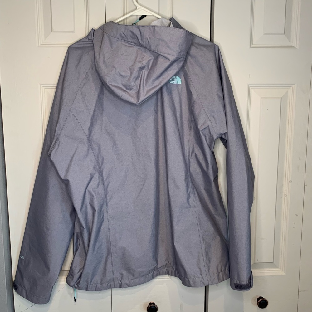 Grey north face rain jacket.